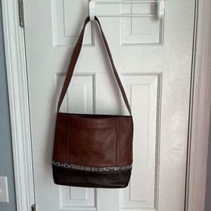 Dark Brown leather bag with decorative bottom trim. The Sak